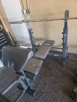 Heavy duty Bench with straight and easy bar plus 240 lbs of plates. Olympic