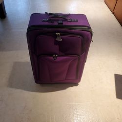 Large purple suitcase