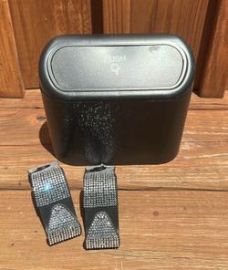 Black and silver car accessories trash bin/ head rest hangers