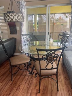 5-Piece Glass Top Dining Set with Metal Scrollwork $150