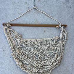hammock chair with a wooden spreader bar and hanging hardware