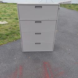 Nice Tan four draw Filing cabinet. With keys