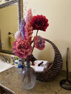 Translucent lavender glass vase with flowers from Mexico