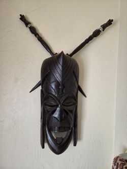 African mask and spears