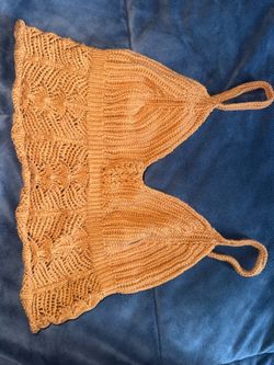 women’s knit crochet lace camisole/crop top in a camel/caramel brown color.