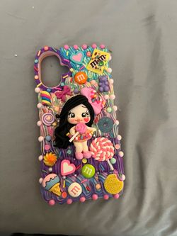 Decorated phone cases with cute charms.