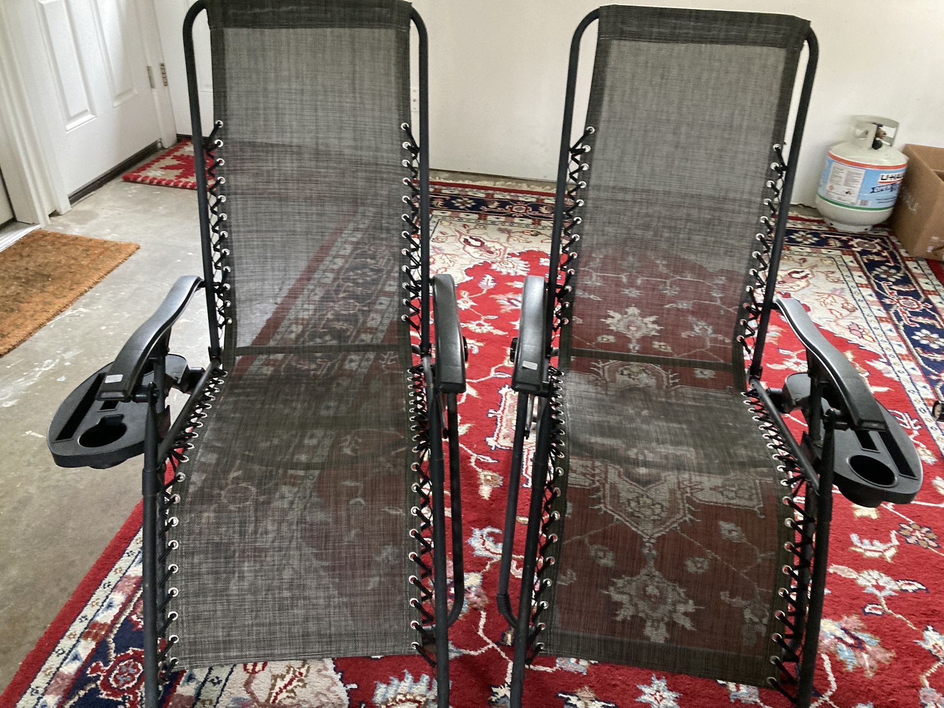 Two Black Reclining Outdoor Chairs