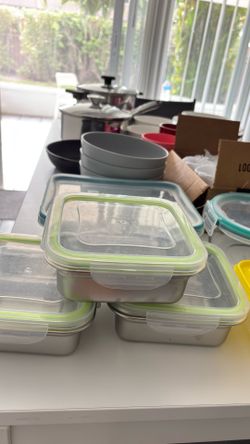glass storage containers, metal storage containers, plastic storage containers, pots, pans, plates, knives, bowls, tea glasses, water and soft drink g