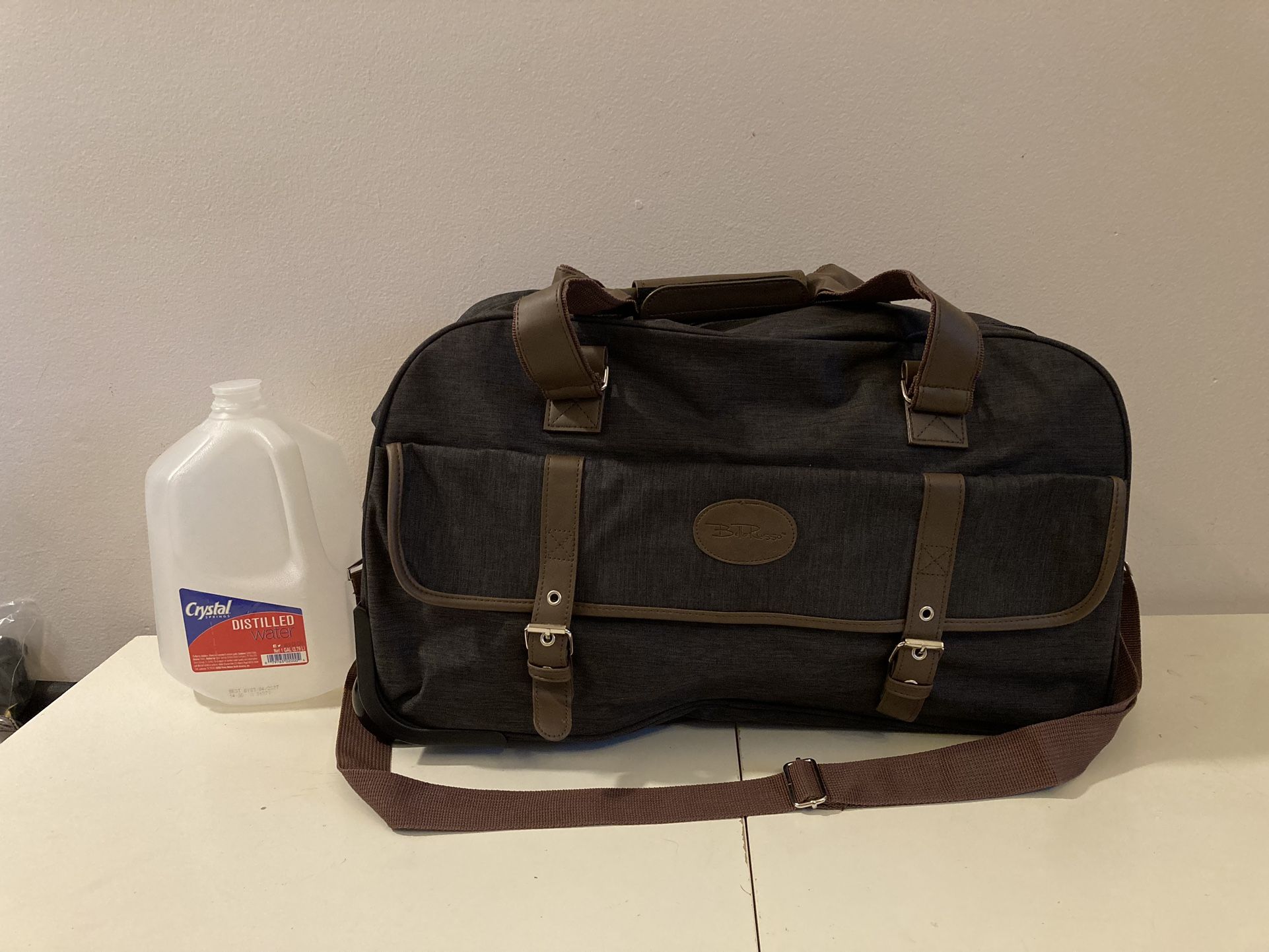 NEW Travel Bag Carry-On w/ Wheels Adj Shoulder Strap 20” x 9 3/4” x 12 1/2”H Bella Russo 