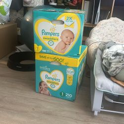 Unused diapers (size 1, size 2)
