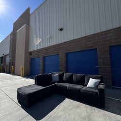 Ashley’s Dark Grey Sectional Couch With Pull Out Bed 