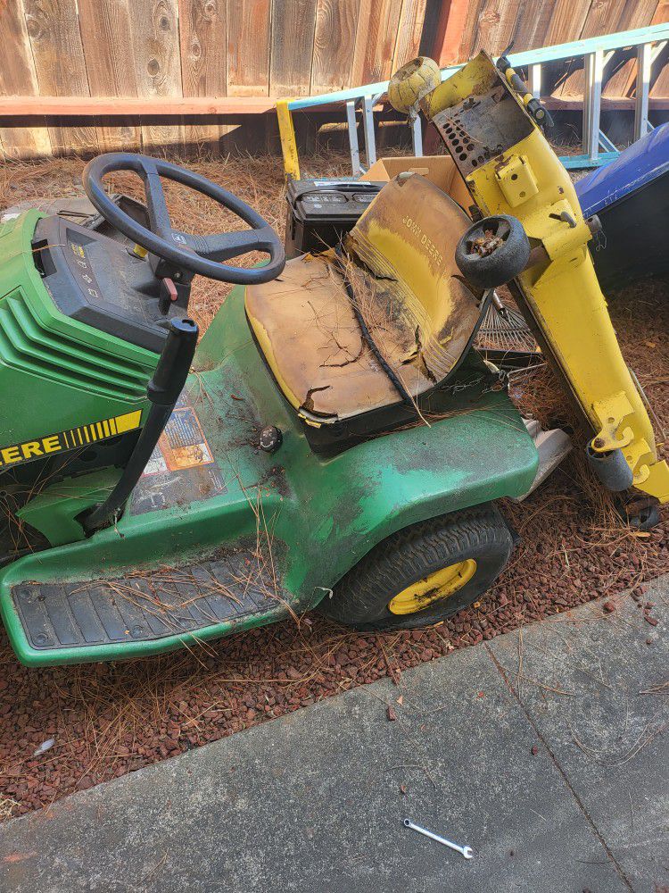 John Dear Ride On Lawn Mower With Blades And Wagon Its A Value Of 2300 Give Me A Offer Ride It Home ..