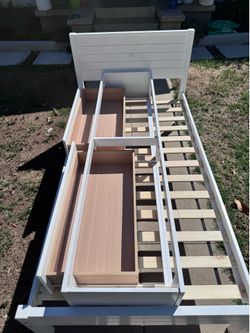 White, twin size bed with drawers