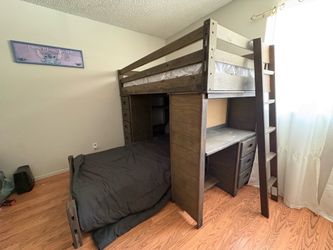 Twin bunk bed with drawers and desk on sides