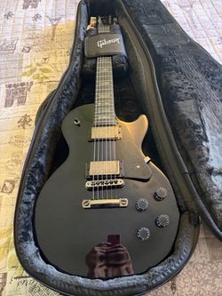 For Sale: 2025 Gibson Les Paul Studio Dark Guitar.