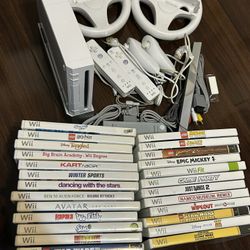 Nintendo Wii console with 2 controllers, all cords, and 20+ games
