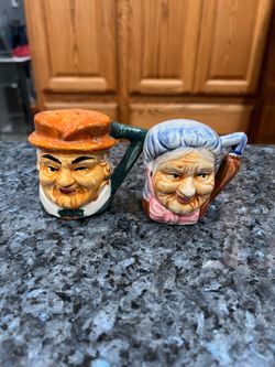 Vintage Old Couple Toby Jug Style 1950’s Salt & Pepper Shakers.  Approximate size 2 3/4 inches tall.  Preowned the man has some tiny chips on hat or w