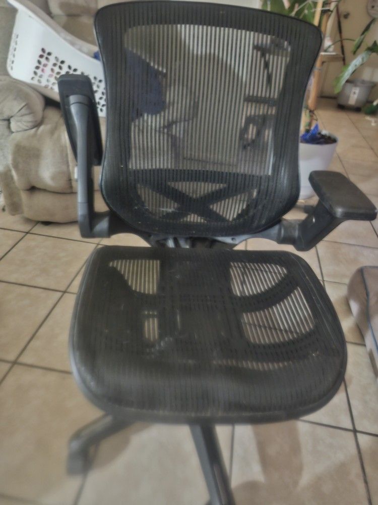 Ventilated Office Chair. It's Adjustable And BRAND New
