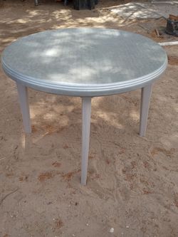 Patio table for chairs and a hold to put a umbrella ( can be taken apart too