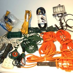 Assortment of extension cords and 4 different drop lights