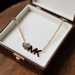 Michael Kors Pave Heart MK Logo Necklace Pendant Goldtone MKJX7977791  NWT