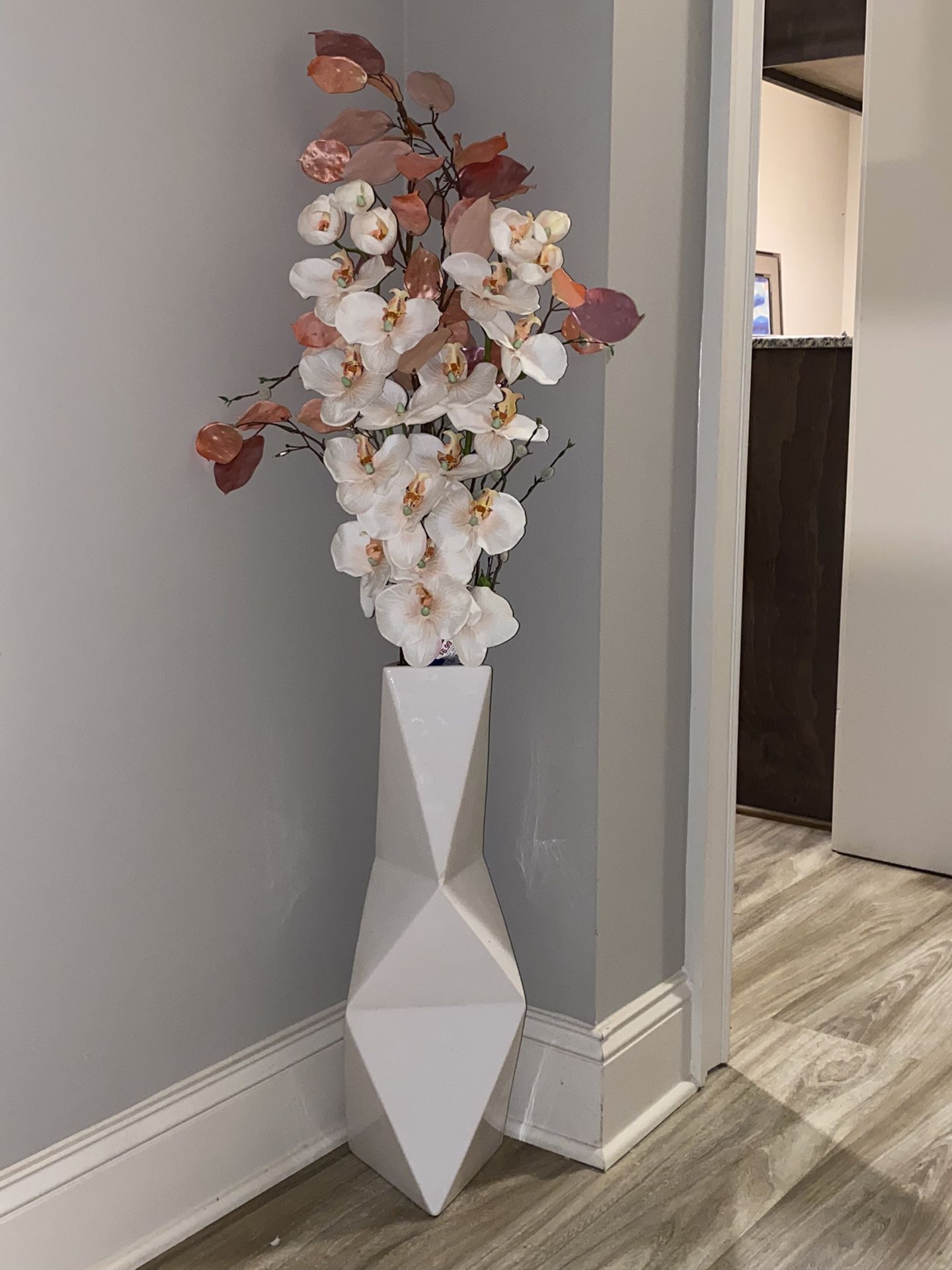 Modern geometric floor vase with orchids