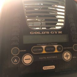 Gold gym elliptical machine. Workout display board with fan.