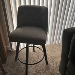 Grey cushioned Swivel Chair