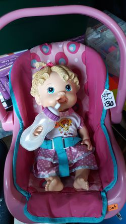 Baby alive with bottle and carrier