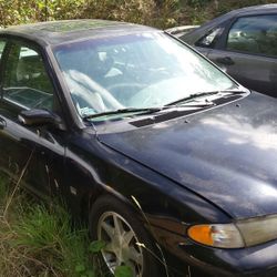 1996 Ford Contour. 2.5 V6 dual overhead cam with 5 speed transmission