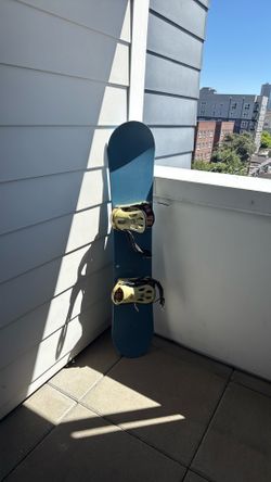 Blank blue snowboard with Bent metal board biscuit bindings