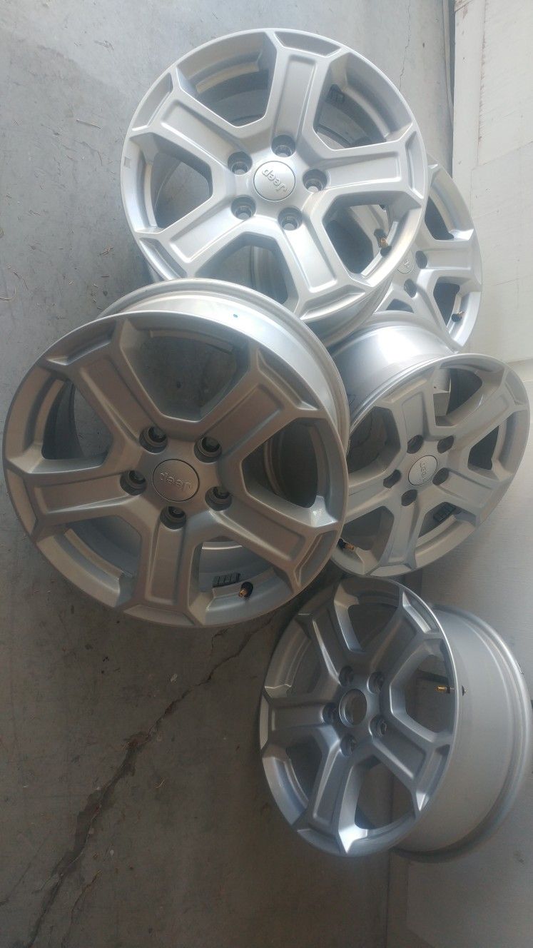 Like new set of five 5x5 17x7 jeep wheels.