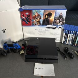 PS4 With Handsets/dock And Over A Dozen Games!