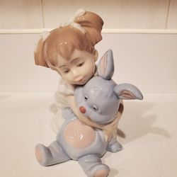 Vintage NAO figurine.  Girl hugging her bunny rabbit, named "I Love You So Much." 