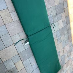 1 Piece chaise lounge chair  Outdoor Patio Furniture Cushions In dark Green  Located in concord  Good condition  No rips or tears   Measures 75” x 21”