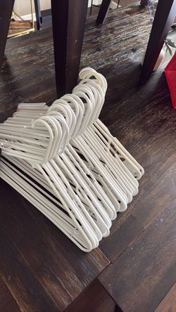 Mostly white/cream colored hangers