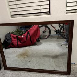 Wood mirror about 45 inches long 33 inches tall Tropicana town center area $60
