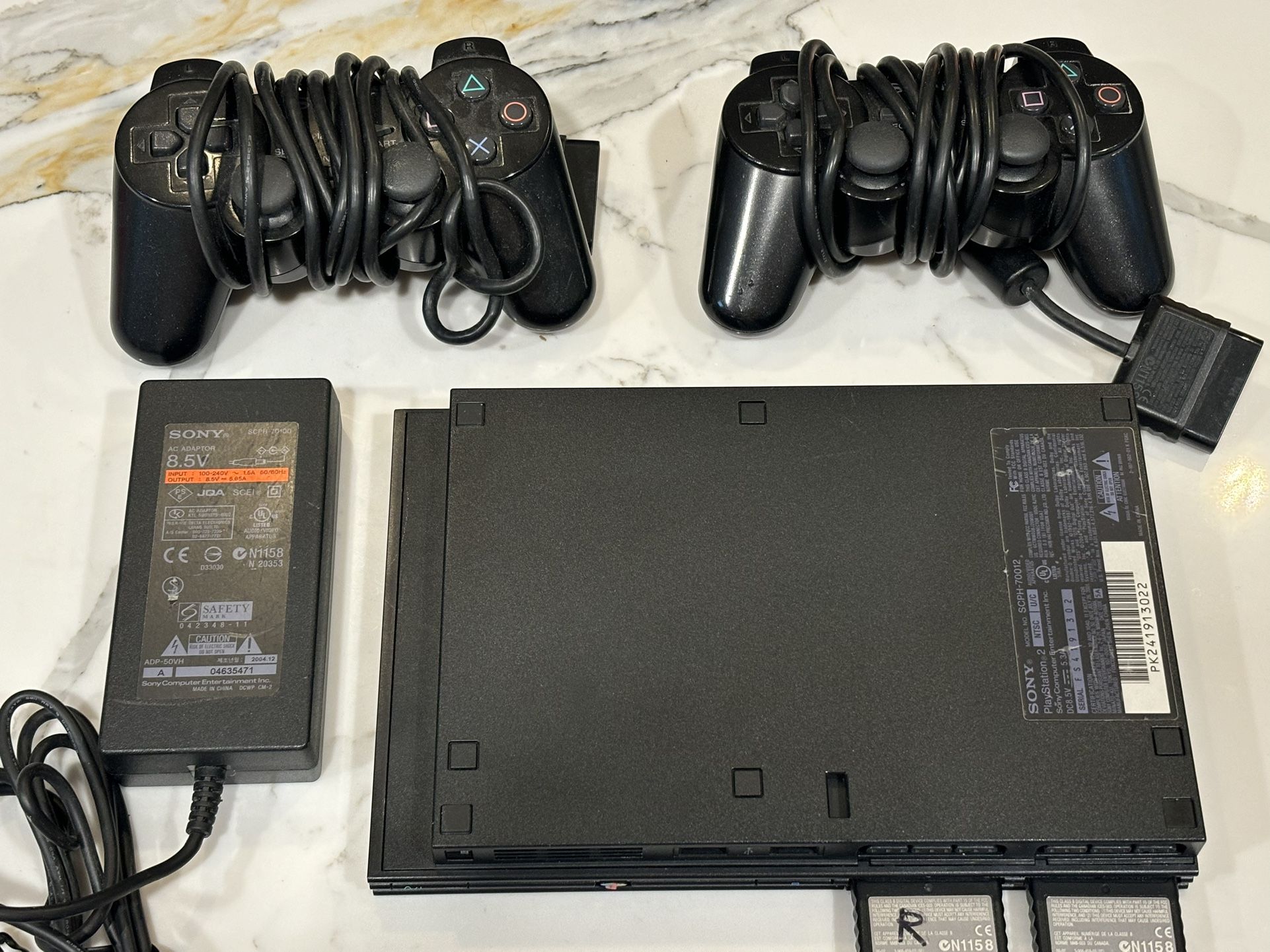 SONY PLAYSTATION PS2 WITH TWO CONTROLLERS AND CARDS