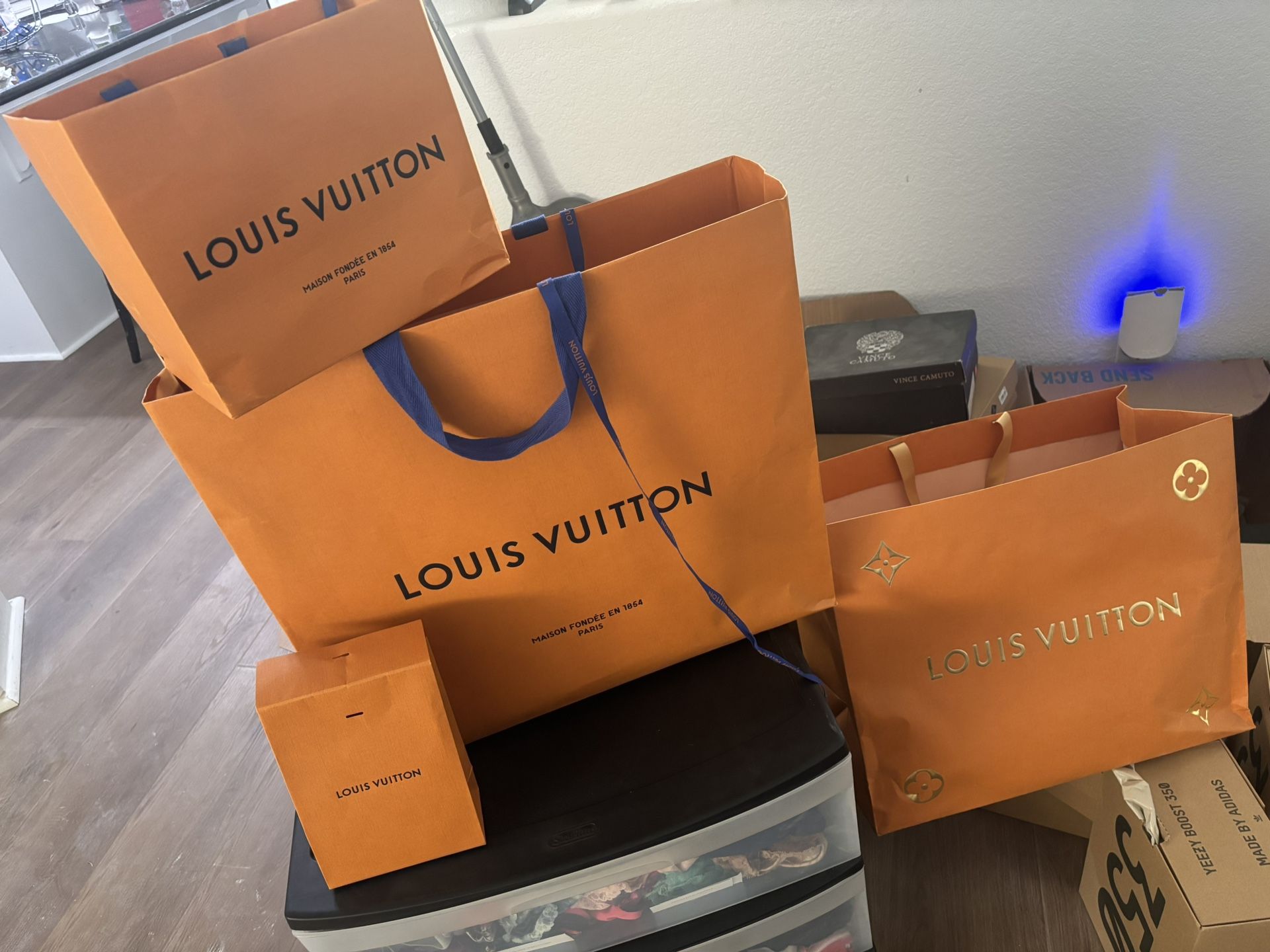 Authentic Louis Vuitton bags and Yeezy boxes empty retail bags