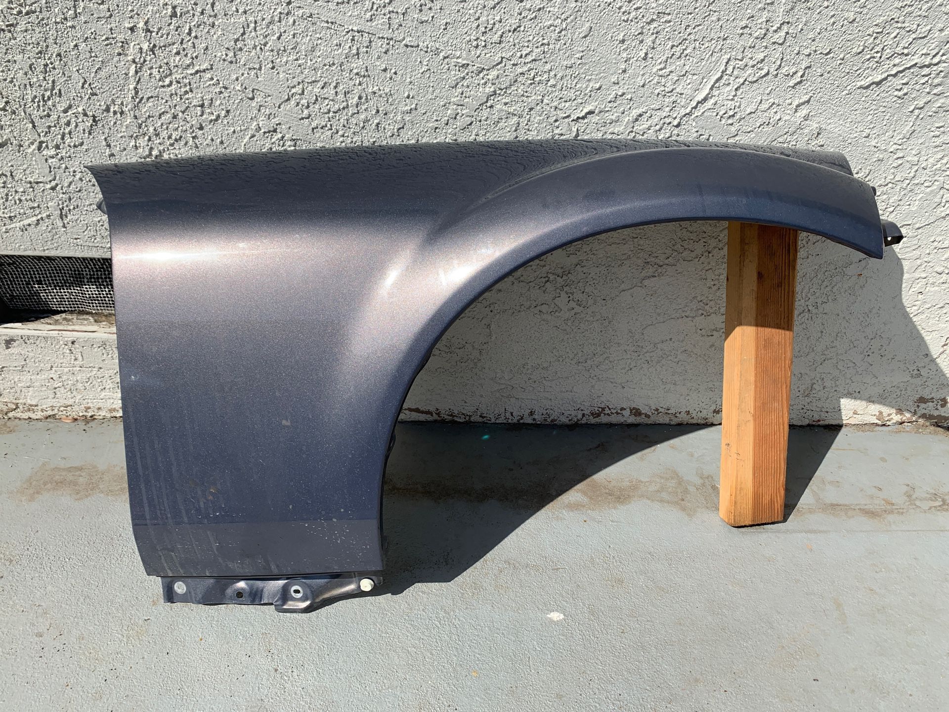 This is a right fender for a 2008 Mazda Miata MX5.