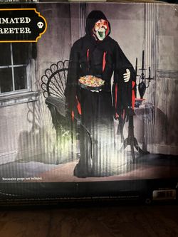 Life-sized animated skeleton greeter 6ft tall