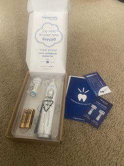 triple bristle electric toothbrush