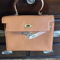 A Hermes Kelly Hand Bag And Cross Body. 