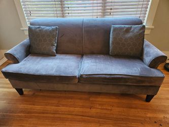 Gray fabric sofa with pillows