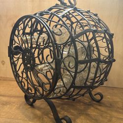 Rustic iron wine rack with intricate design, 14”L x 15”W x 16” H