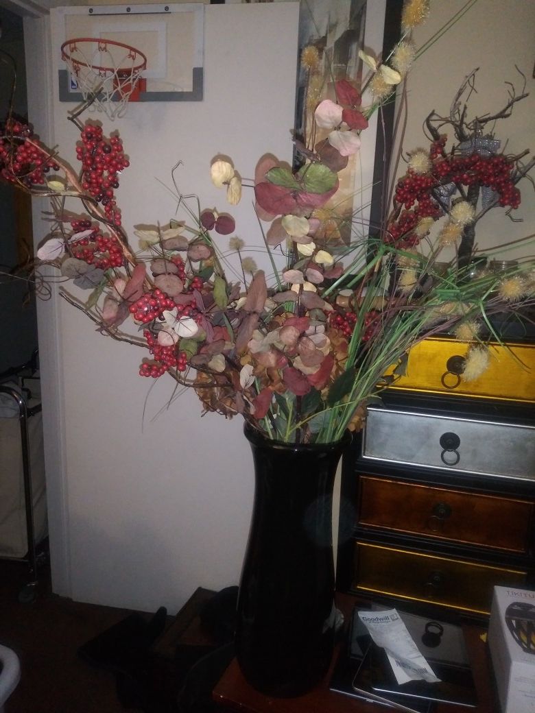 Tall vase with artificial flower
