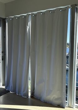 tension rods and white blackout curtains