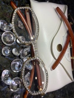 Millionaire Celebrity Glasses “Look Like Money” One (1) Unisex wooden frame with sparkling lab, diamond ice trim. Comes with a white protective case f