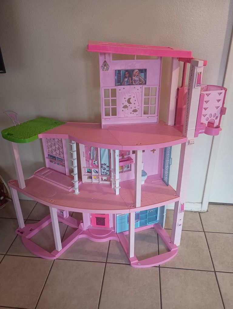 Barbie Dream House Does not include accessories... Has sounds and its manual lift works