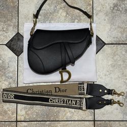 Black Dior Saddle Bag With Gold Accents 